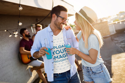 V-Neck T-Shirt Mockup of a Man Celebrating with His Girlfriend