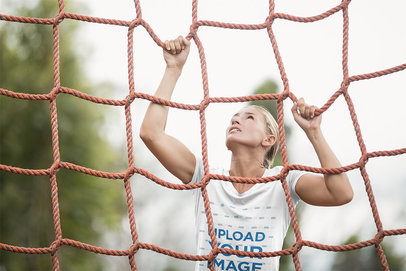 T-Shirt Mockup of a Military Recruit Woman Climbing a Net