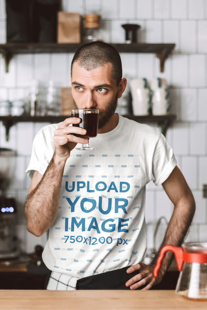 T-Shirt Mockup Featuring a Barista Drinking Coffee