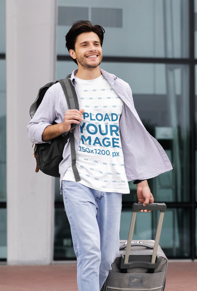 Mockup of a Man with a Crewneck Tee Walking with a Suitcase
