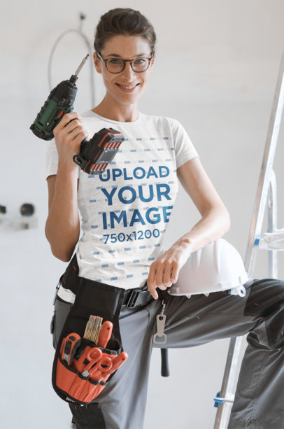 T-Shirt Mockup Featuring a Woman Holding a Drill 