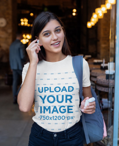 T-Shirt Mockup Featuring a Young Woman Using Wireless Earbuds 40722-r-el2