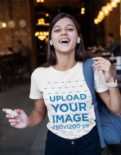 T-Shirt Mockup Featuring a Female Student Laughing 