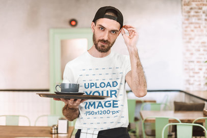 T-Shirt Mockup of a Waiter Posing at a Restaurant