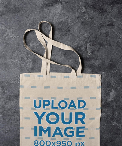 Mockup of a Sublimated Tote Bag Placed on a Marble Surface