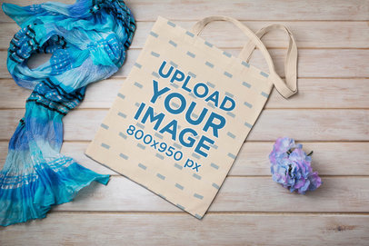 Mockup of a Tote Bag Placed Next to a Decoration Flower
