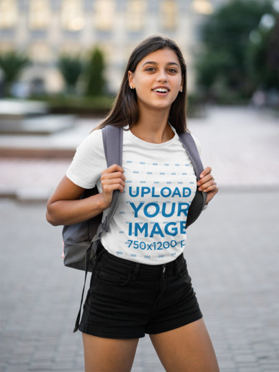 T-Shirt Mockup Featuring a Young Female Student 