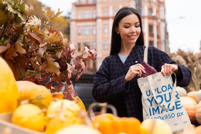 Tote Bag Mockup of a Happy Woman Buying Pumpkins 41752-r-el2