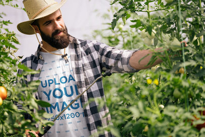 T-Shirt Mockup of a Bearded Farmer Fertilizing Some Tomato Plants 40163-r-el2