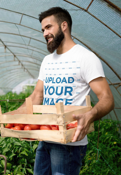 T-Shirt Mockup Featuring a Happy Man in a Greenhouse 