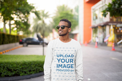 Long Sleeve Tee Mockup of a Young Man at a Mall