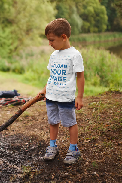 Mockup of a Kid Wearing a T-Shirt in the Forest 42088-r-el2