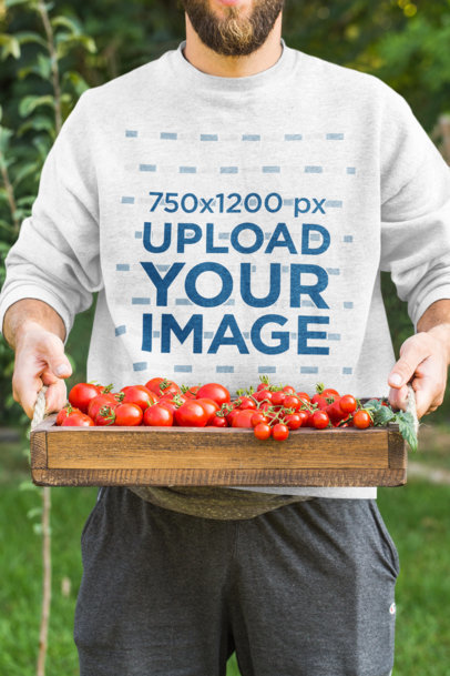 Cropped Face Mockup of a Man with a Sweatshirt Holding a Trail of a Tomatoes
