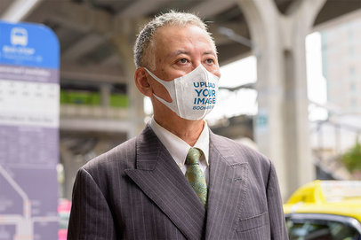 Face Mask Mockup of an Elderly Man in a Suit