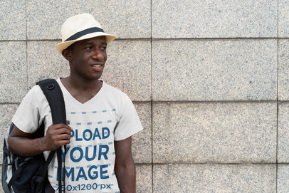 Mockup of a Tourist Wearing a V-Neck Tee on the Street
