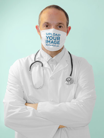 Face Mask Mockup Featuring a Serious Doctor in a Studio