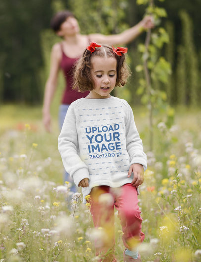Crewneck Sweatshirt Mockup Featuring a Girl Walking Through a Field of Flowers 34784-r-el2