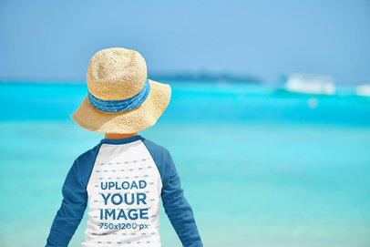 Back View Mockup of a Boy Wearing a Raglan Long-Sleeve Tee at the Beach