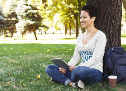 V-Neck Long Sleeve Tee Mockup of a Smiling Woman Sitting in the Park