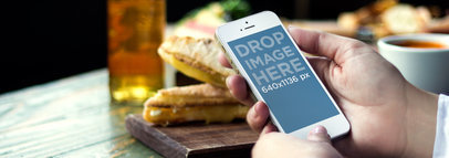 iPhone 5s Gold Portrait Woman Holding It Bistro Wide