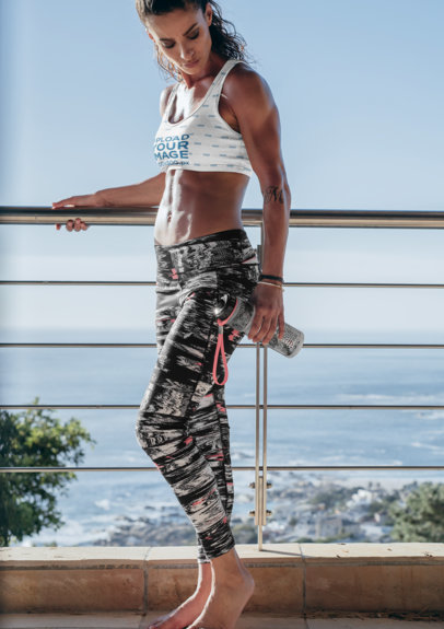 Sports Bra Mockup Featuring a Woman on a Beach-View Balcony 