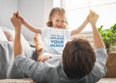 T-Shirt Mockup of a Little Girl Playing with Her Dad at Home