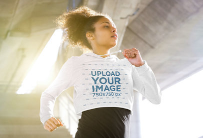 Crop Top Hoodie Mockup Featuring a Woman Running