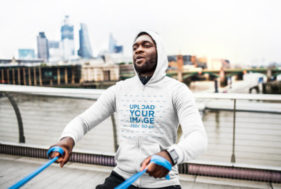 Heather Hoodie Mockup of a Man Exercising in the City