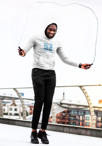 Hoodie Mockup of a Man Doing Cardio in the City