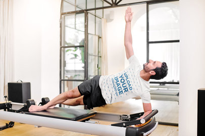 T-Shirt Mockup of a Man Doing a Side Plank on a Machine 38673-r-el2