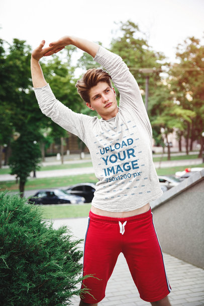 Mockup of a Man with a Heather Long-Sleeve Tee Stretching Outside 39359-r-el2