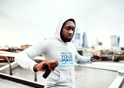 Full-Zip Hoodie Mockup of a Man Preparing to Exercise in the City