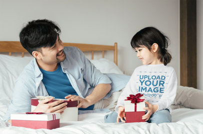 Long Sleeve Tee Mockup of a Girl and Her Dad Holding Christmas Presents 
