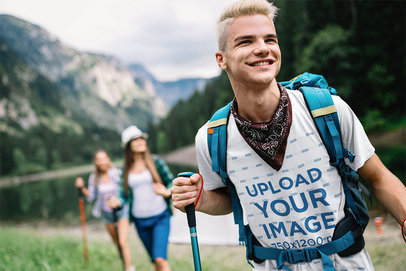 T-Shirt Mockup Featuring a Smiling Man on a Hike