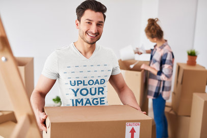 V-Neck T-Shirt Mockup of a Man Packing for a Move
