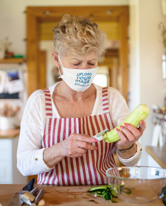 Face Mask Mockup of a Senior Woman Cooking at Home