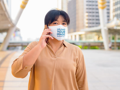 Face Mask Mockup of a Woman Talking on the Phone at a Mall 41628-r-el2