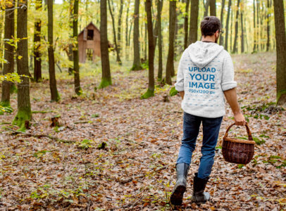 Back-View Hoodie Mockup of a Farmer in the Woods 40924-r-el2