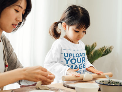 Long Sleeve Tee Mockup Featuring a Girl Baking With Her Mother 