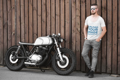 Mockup of a Man with a Scoop Neck Tee Posing Next to a Motorcycle 41680-r-el2