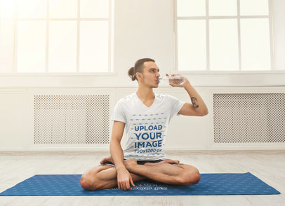 V-Neck T-Shirt Mockup of a Man Sitting on a Yoga Mat