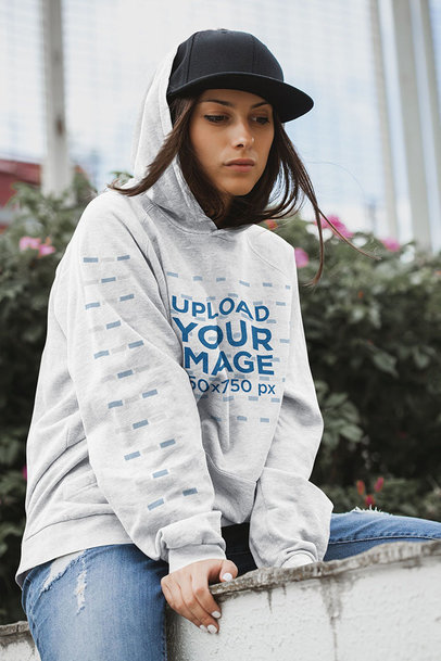 Mockup of a Woman Wearing an Oversize Heathered Hoodie Outside