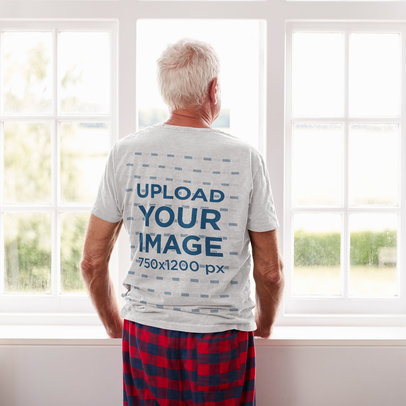 Back-View T-Shirt Mockup of a Senior Man at Home