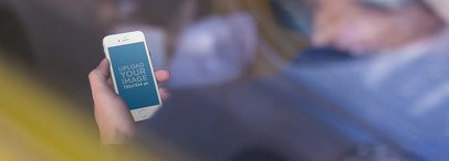 Mockup of a Hand Holding a White iPhone SE a13999wide