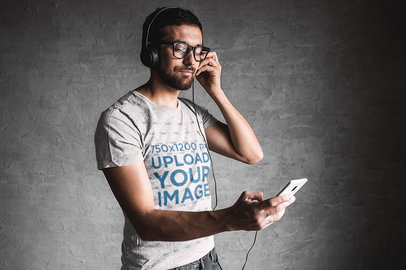 Mockup of a Bearded Man with a Heathered Tee Listening to Music 39873-r-el2