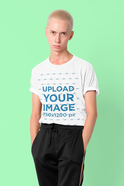 T-Shirt Mockup Featuring a Man with a Nose Piercing Posing in a Studio