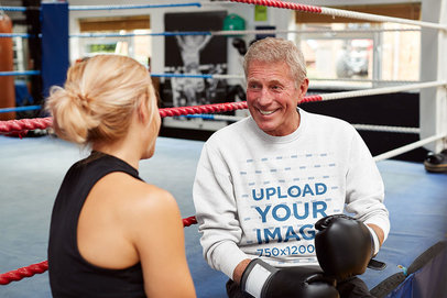 Mockup of a Senior Boxing Coach Wearing a Sweatshirt 39993-r-el2