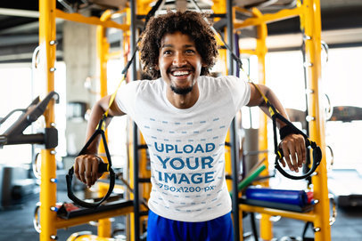 T-Shirt Mockup of a Man Exercising with Suspension Straps