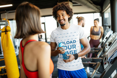 T-Shirt Mockup of a Man Chatting with a Woman at the Gym