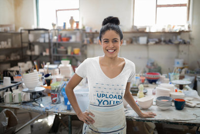 T-Shirt Mockup of a Smiling Woman at a Pottery